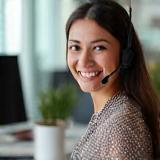 Friendly SwiftTrack support agent answering client call